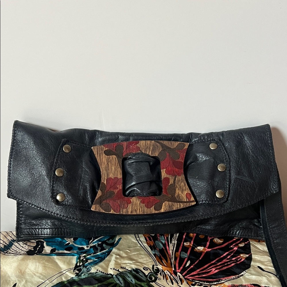 Inherited leather vintage clutch with engraved wood and stud accents